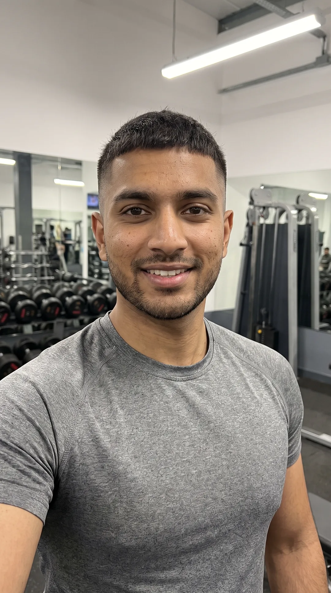 Personal trainer coaching clients online from a UK gym